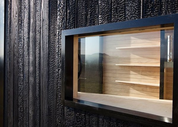 Exterior finish - burned cladding. Exterior finish - burned cladding.