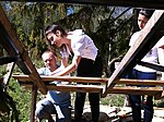 Italian students making a wood shindles roof for a first time