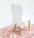 A chair with angel wings 