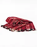 Red plaid woven throw on white