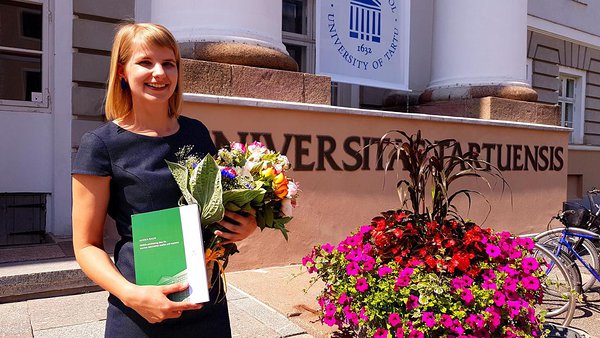 The fresh PhD graduate, Janika Raun, in front of the Unversity of Tartu. Photo: Janika Raun