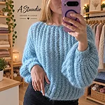 Cozy blue knitwear boutique selfie