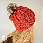 Women winter hat brick red cable knit brown faux fur pom rahecraft sideview