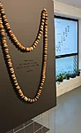 „Vanaema Hilda palvehelmed” / „Grandmother Hilda’s prayer beads”  arvelaua nupud, kleebis, 2024 / Beads from the counting frame, sticker, 2024