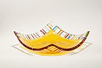 Fused glass plate yellow with a striped edge