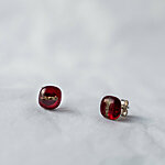 Dark red glass earrings with stripe decoration.