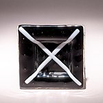 Small fused glass plate, black with white cross