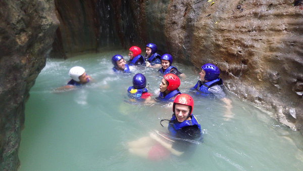 Congregating before sliding down another of the 27 Damajagua waterfalls