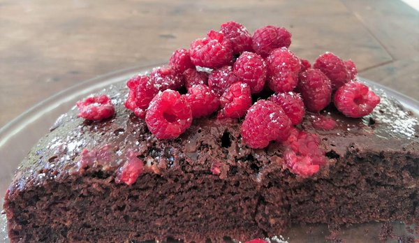 Tasty vegan chocolate cake with local organic raspberries