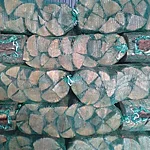 Kiln-dried firewood in green mesh bags at the Tammaru Farm warehouse