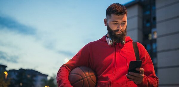 Basketball player reading text message