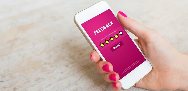 Customer submitting feedback on mobile phone