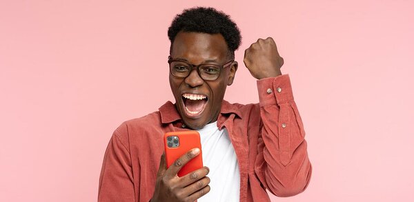 Jubilant person looking at mobile phone