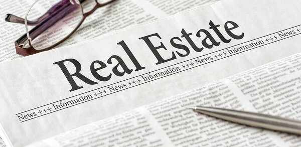 Newspaper showing real estate section