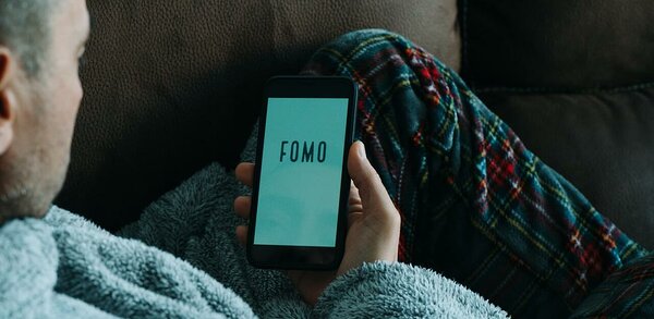 Phone addiction concept of FOMO - fear of missing out
