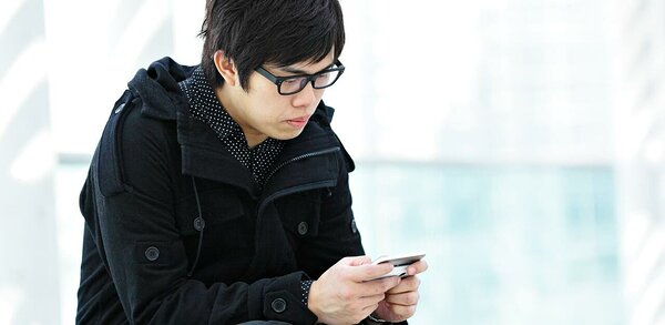 Asian man using a smartphone