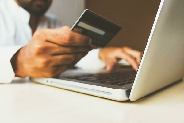 Man making an online purchase with a credit card