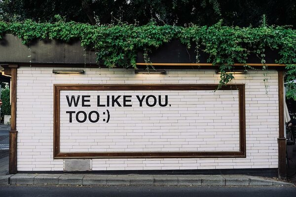 "We like you too" message on a wall