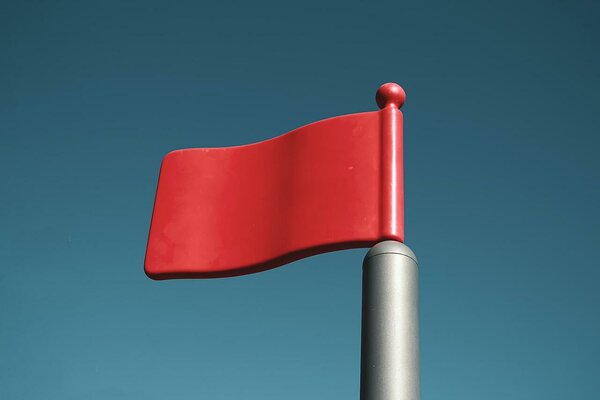 Red plastic flag on a pole
