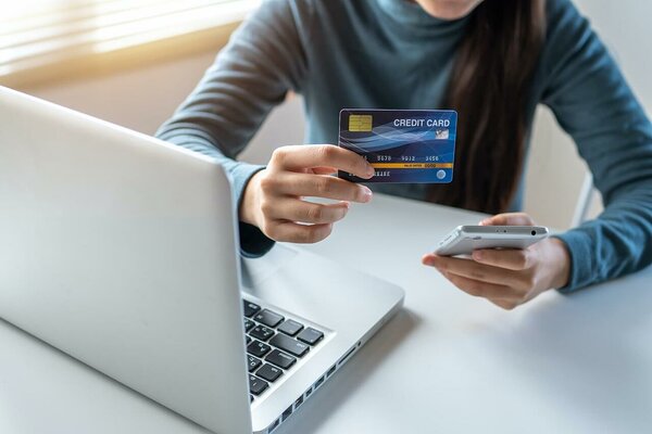 Woman showing a credit card