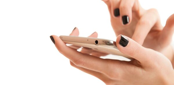 Woman with black nails using a smartphone