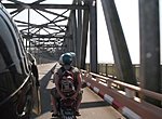 crossinf a bridge on motorbikes