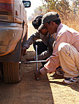 John and Sokhom changing the tyre