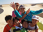 kids in white dunes