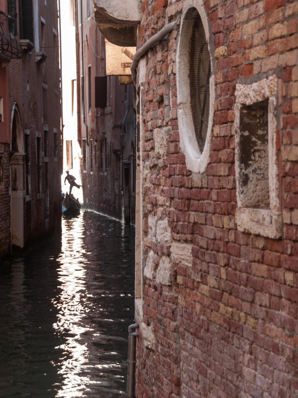 gondolier stearing his gondola, Venice, Italy