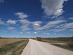 landscape with gravel road and clouds