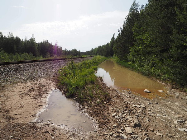 to the railway or into the river?