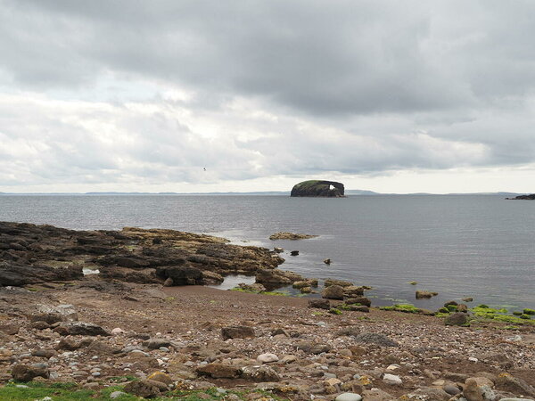 Dore Holm with some seals on the foreground