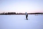 Back-country skiing over a frozen lake in Rovaniemi Lapland Finland