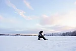 Ice Fishing on a Frozen Lake in the winter in Rovaniemi Lapland Finland