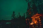 Taking a break around the campfire in Rovaniemi Lapland Finland