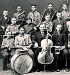 Paul Kondas (with cello) with Suure-Jaani school orchestra