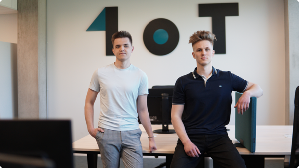 1oT Internship Programme Class '22 graduates Artur-Aleksander and Caspar, who are now full-time employees of 1oT.