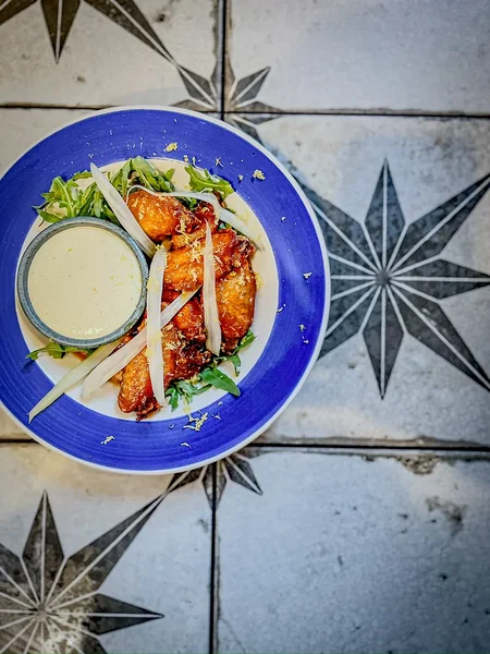 Spicy Korean chicken wings with a rich glaze – a look at one of koduKOHVIK’s most popular dishes.