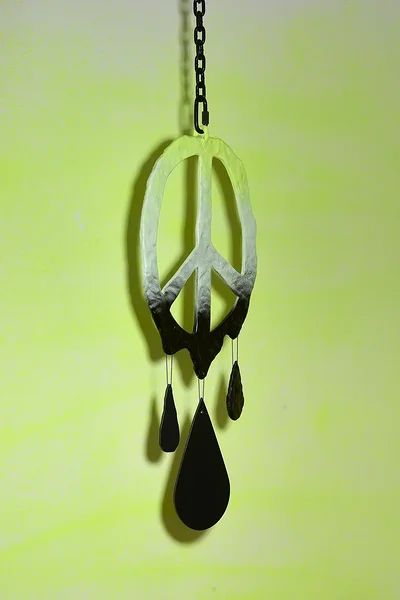 Peace (dripping black), 2026, dibond, epoxy, alkyd, powder coated steel chain, hardware, 38 1/4 x 15 x 1 1/2 inches 