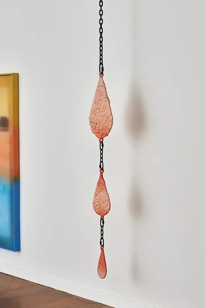 Drops (the dream), 2026, dibond, epoxy, alkyd, powder coated steel chain, hardware, 62 x 9 1/2 x 2 inches 