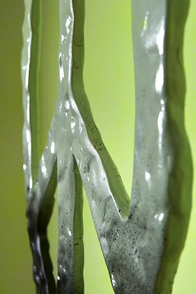 Peace (dripping black), 2026, dibond, epoxy, alkyd, powder coated steel chain, hardware, 38 1/4 x 15 x 1 1/2 inches 