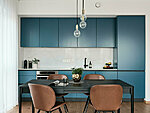blue kitchen with quartz worktop and backsplash