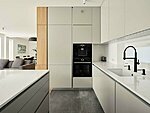 light grey bespoke kitchen with veneer cupboard