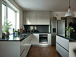 light grey kitchen with granite worktop