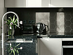 light grey kitchen with granite worktop, stainless steel Franke EOS NEO faucet in combination with Franke MRX 110-50 sink