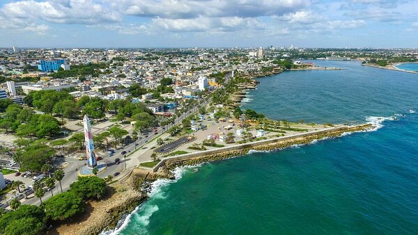 The Malecon, Santo Domingo's Caribbean seafront promenade, visited on the Cocotours Santo Domingo tour. In top  right of the picture is where the Ozama river meets the sea, and the location of the Don Diego cruise terminal