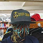 Stiff skunk logo grey black gold cap 1