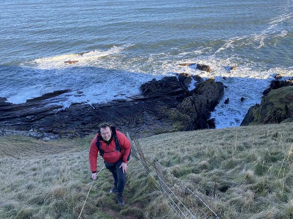 Climbing up the steep slope of the Siccar Point with Tim Kearsey leading the way. Photo: Heikki Bauert.