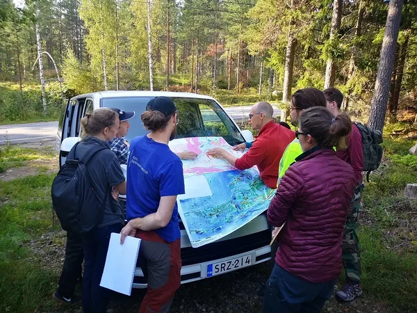 Janne Hokka showing geological maps of the study area.