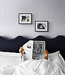 Man reading newspaper in bed(1) 1